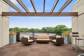 Rooftop piazza exclusive to townhome residents with grilling station and seating